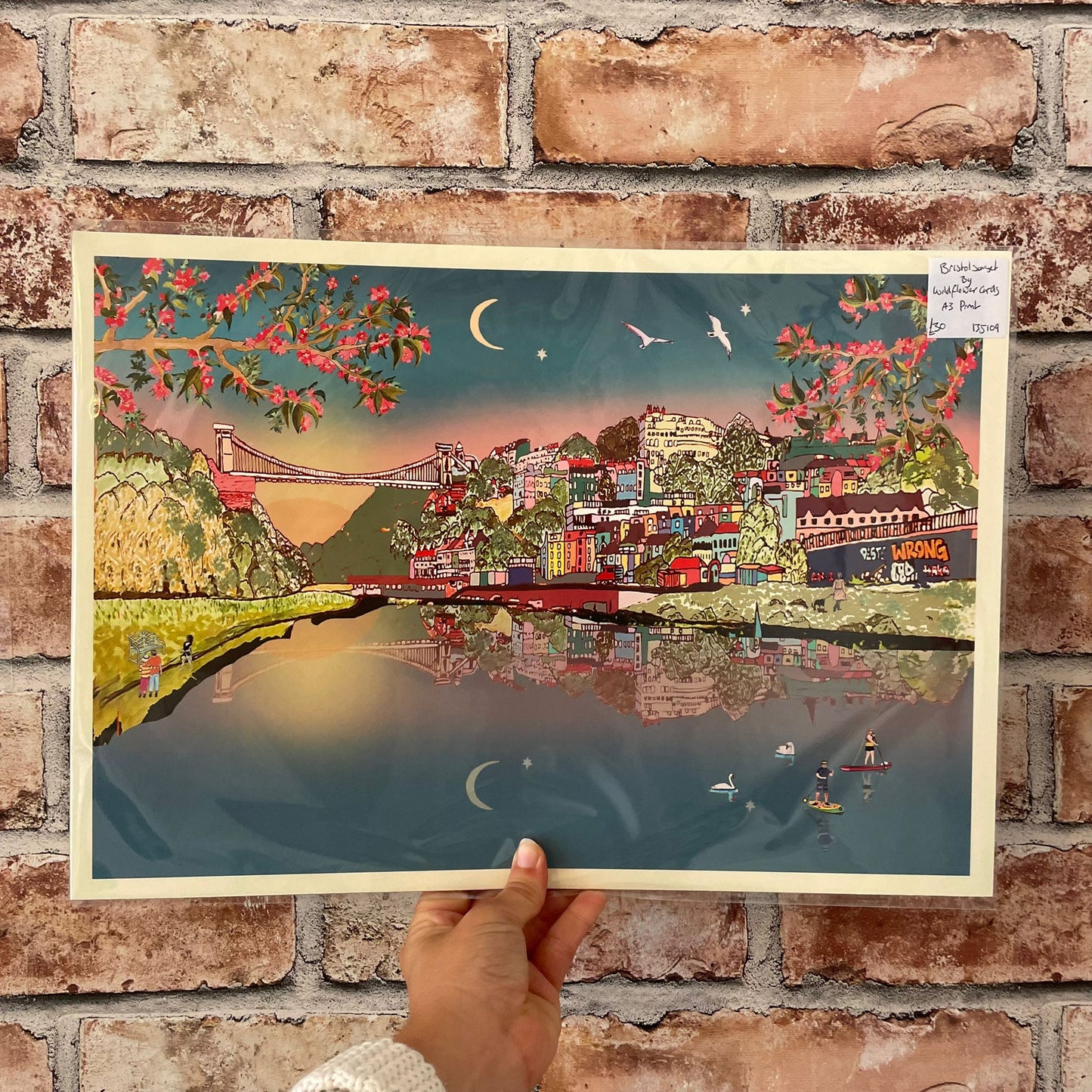 Artwork of Clifton Bridge with cherry blossoms against the night sky.